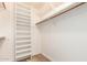 Walk-in closet with built-in shelving and ample storage space at 7955 E Chaparral Rd # 141, Scottsdale, AZ 85250