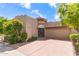 Charming home featuring well-maintained desert landscaping, a two-car garage, and a welcoming courtyard entrance at 7955 E Chaparral Rd # 141, Scottsdale, AZ 85250