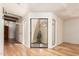 Bright living space featuring wood floors, a courtyard view, and neutral walls with a modern feel at 7955 E Chaparral Rd # 141, Scottsdale, AZ 85250