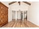 Open living area featuring wood floors, neutral walls, and a view of the entrance to the home at 7955 E Chaparral Rd # 141, Scottsdale, AZ 85250