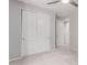 Carpeted bedroom featuring large closet doors and neutral wall paint at 8010 W Atlantis Way, Phoenix, AZ 85043