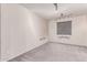 Bedroom with gray carpet, neutral walls, and modern track lighting fixture at 8010 W Atlantis Way, Phoenix, AZ 85043