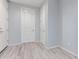 Neutral hallway with tile floors and white doors at 8010 W Atlantis Way, Phoenix, AZ 85043