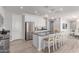 The kitchen features stainless steel appliances, a center island with seating, and granite countertops at 8010 W Atlantis Way, Phoenix, AZ 85043