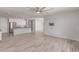 Bright Living Room featuring neutral colors, modern lighting and tiled floors leading to the Kitchen at 8010 W Atlantis Way, Phoenix, AZ 85043