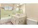 Bathroom featuring a single sink vanity, and a bathtub with a shower at 8121 N 8Th Ave, Phoenix, AZ 85021