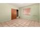 Cozy bedroom featuring tiled flooring, a sliding-door closet, and one window at 8121 N 8Th Ave, Phoenix, AZ 85021
