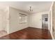 Dining area with hardwood floors, chandelier, and doorway to a kitchen with checkerboard tiles at 8121 N 8Th Ave, Phoenix, AZ 85021