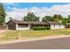 Inviting single-story home showcasing a well-maintained lawn and a classic mailbox at 8121 N 8Th Ave, Phoenix, AZ 85021