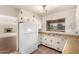 Charming kitchen with vintage cabinets, a classic refrigerator, and a cozy breakfast nook at 8121 N 8Th Ave, Phoenix, AZ 85021