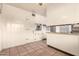 Classic kitchen features white cabinets, oven and a neutral-toned floor at 8121 N 8Th Ave, Phoenix, AZ 85021