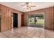 Bright living room with a ceiling fan and a sliding glass door leading to the yard at 8121 N 8Th Ave, Phoenix, AZ 85021