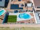 Aerial view of a home featuring a backyard with a pool, patio, and lush green grass area at 821 E Harmony Ave, Mesa, AZ 85204