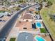 Aerial shot showcasing a backyard pool, roof-mounted solar panels, and the neighborhood surroundings at 821 E Harmony Ave, Mesa, AZ 85204