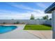 Beautiful backyard with a well-maintained lawn and refreshing pool, perfect for outdoor relaxation and entertaining at 821 E Harmony Ave, Mesa, AZ 85204