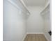 Walk-in closet with two closet rods and new flooring in the main bedroom at 821 E Harmony Ave, Mesa, AZ 85204