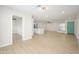 Bright open floor plan with modern ceiling fan, flooring, and view into the entry way at 821 E Harmony Ave, Mesa, AZ 85204