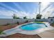 Backyard in-ground pool surrounded by lush landscaping at 821 E Harmony Ave, Mesa, AZ 85204
