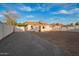 Home's backyard with a gravel area, with an awning adding shade and charm to the outdoor space at 9042 N 3Rd Ave, Phoenix, AZ 85021