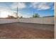 Fenced backyard with light-colored gravel, providing privacy and a clean space for outdoor enjoyment at 9042 N 3Rd Ave, Phoenix, AZ 85021