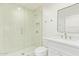 Bathroom featuring tile shower with glass door and vanity with mirror at 9042 N 3Rd Ave, Phoenix, AZ 85021