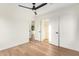 Bedroom with hardwood floors, a ceiling fan, and a closet at 9042 N 3Rd Ave, Phoenix, AZ 85021