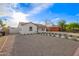 Attractive home with white painted brick, desert landscaping, and a fenced side yard at 9042 N 3Rd Ave, Phoenix, AZ 85021