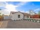 Attractive home with white painted brick, desert landscaping, and a fenced side yard at 9042 N 3Rd Ave, Phoenix, AZ 85021