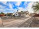 Attractive home with white painted brick, desert landscaping, long drive way, and covered parking area at 9042 N 3Rd Ave, Phoenix, AZ 85021