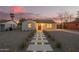 Charming single-story home with walkway lighting and a desert-landscaped front yard at 9042 N 3Rd Ave, Phoenix, AZ 85021