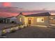 Quaint house with concrete walkway lighting and well-maintained landscaping at 9042 N 3Rd Ave, Phoenix, AZ 85021