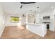 Bright, open kitchen and living space with modern finishes and stainless steel appliances for seamless entertaining at 9042 N 3Rd Ave, Phoenix, AZ 85021