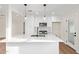 Updated kitchen with white cabinetry, quartz counters, stainless steel appliances, and a modern black faucet at 9042 N 3Rd Ave, Phoenix, AZ 85021