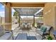 Cozy outdoor patio area with pergola, dining set, and comfortable seating at 913 W Leadwood Ave, Queen Creek, AZ 85140