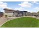 Expansive backyard featuring a pergola-covered patio and well-maintained lawn at 913 W Leadwood Ave, Queen Creek, AZ 85140
