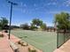 Community basketball court surrounded by mature trees and landscaping at 913 W Leadwood Ave, Queen Creek, AZ 85140