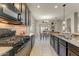 Well-equipped kitchen with granite counters, tile backsplash, and a view of the dining area at 913 W Leadwood Ave, Queen Creek, AZ 85140