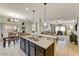 Open concept kitchen and dining area, perfect for entertaining and Gathering meals at 913 W Leadwood Ave, Queen Creek, AZ 85140