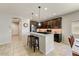 Stylish kitchen with a breakfast bar, stainless steel appliances, and ample cabinet space at 913 W Leadwood Ave, Queen Creek, AZ 85140