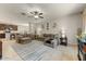 Open-concept living room with comfortable seating and stylish decor at 913 W Leadwood Ave, Queen Creek, AZ 85140