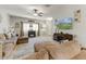 Inviting living room with comfortable seating, a mounted TV, and a view of the home's entrance at 913 W Leadwood Ave, Queen Creek, AZ 85140
