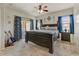 Comfortable main bedroom with a king-size bed, soft carpet, and access to the backyard at 913 W Leadwood Ave, Queen Creek, AZ 85140