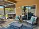 Outdoor patio featuring multiple seating areas, a hot tub, and a ceiling fan at 913 W Leadwood Ave, Queen Creek, AZ 85140