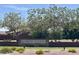 Entrance sign for the 'Ironwood Crossing' community, showcasing manicured landscaping and mature trees at 913 W Leadwood Ave, Queen Creek, AZ 85140
