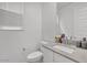 Clean bathroom with a modern vanity, neutral countertop, and minimalist decor at 9444 W Roma Ave, Phoenix, AZ 85037