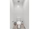 Bright and simple half-bathroom featuring a toilet and modern fixtures at 9444 W Roma Ave, Phoenix, AZ 85037