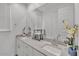 Bathroom features double sinks, ample counter space, and a large mirror, creating a functional and stylish space at 9444 W Roma Ave, Phoenix, AZ 85037