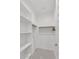 Walk-in closet with ample shelving and hanging space for organization at 9444 W Roma Ave, Phoenix, AZ 85037