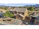 Aerial view of a two-story home with a spacious driveway, landscaping, and a fenced backyard at 9719 W Heber Rd, Tolleson, AZ 85353