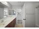 Bathroom with a double sink vanity and full shower/tub featuring tiled floors at 9719 W Heber Rd, Tolleson, AZ 85353